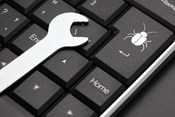 registry reviver registry cleaner software features wrench on black computer keyboard debug key